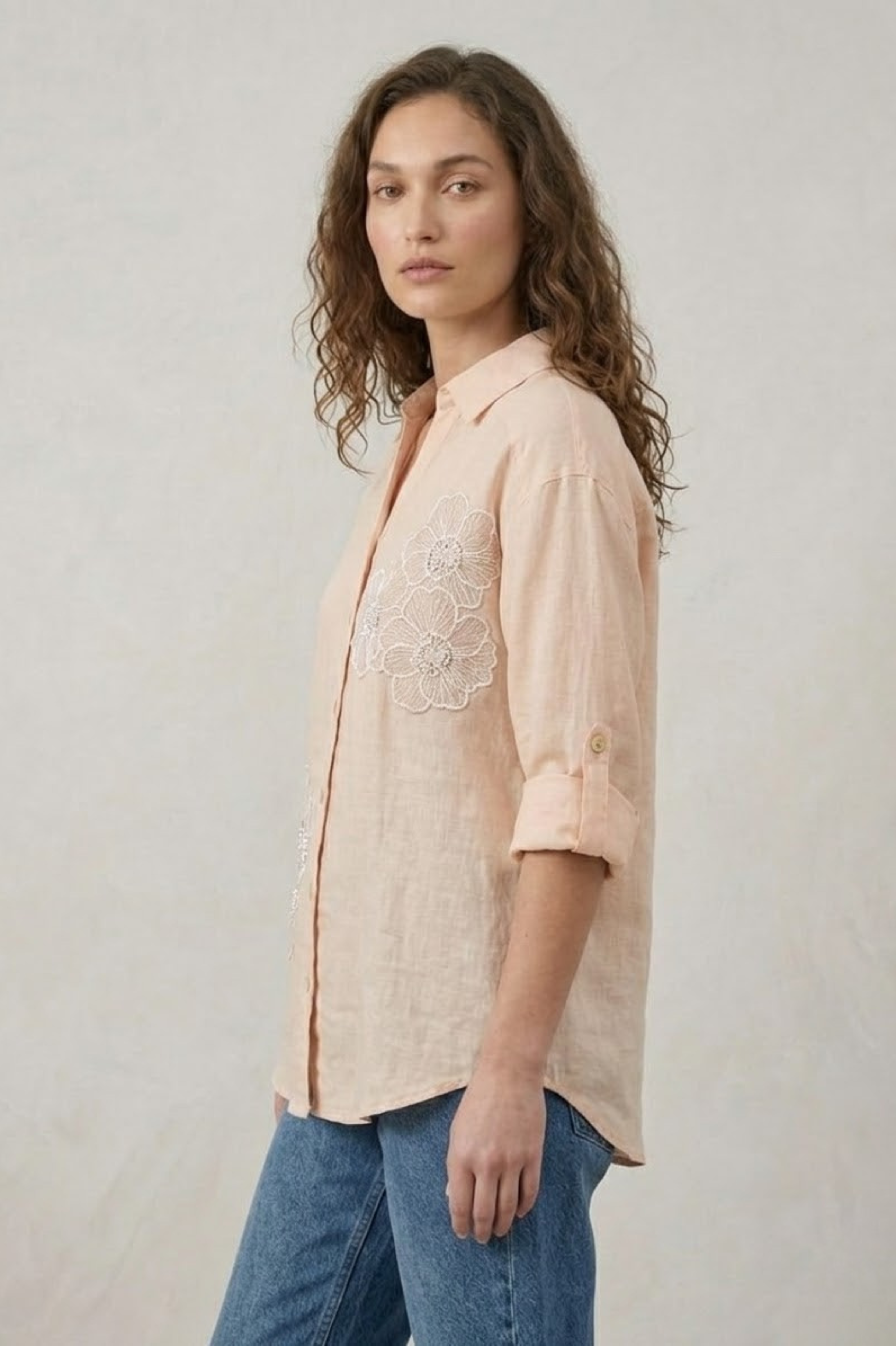 Light pink embroidered linen shirt for women; reversible reversible top with delicate needlework details.