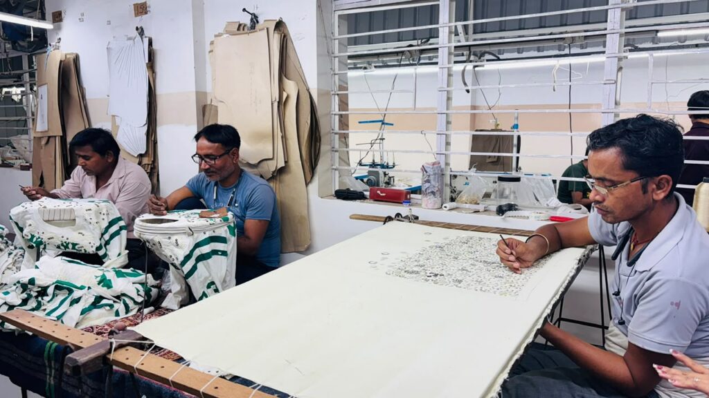 Ecoleas artisans at the hand-embroidery frames